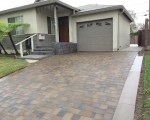 Paver driveway with a concrete ribon